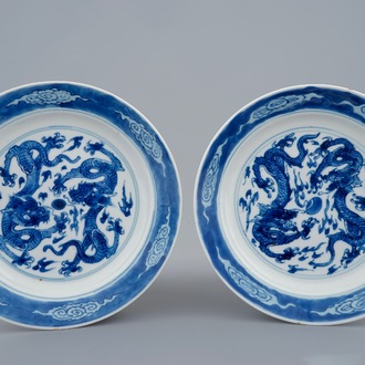 A pair of Chinese blue and white dragon plates, Xuande marks, Kangxi