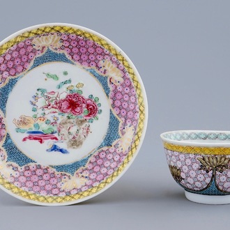 A Chinese famille eggshell rose cup and saucer with a central flowervase, Yongzheng, 1723-1735