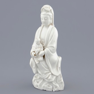 A Chinese Dehua blanc de Chine model of Guanyin with child, 19th C.