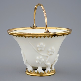 A Chinese blanc de Chine libation cup with gilt bronze mounts, Kangxi