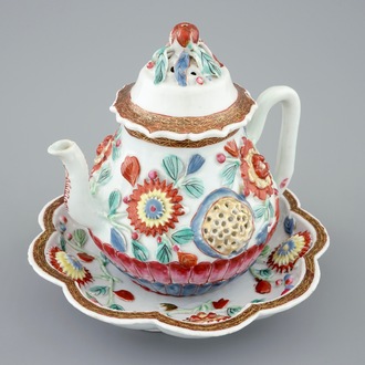 A Chinese moulded and applied famille rose teapot and cover on stand, Yongzheng, 1723-1735