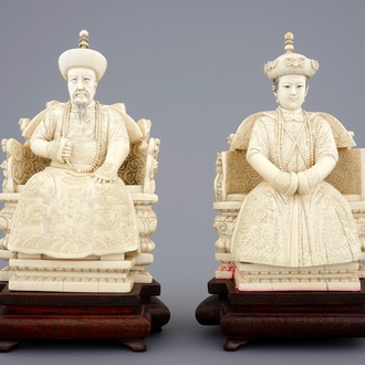 A pair of Chinese ivory figures of the emperor couple seated on a throne, ca. 1900