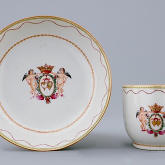 A Chinese famille rose cup and saucer with cherubs, Qianlong, 18th C.