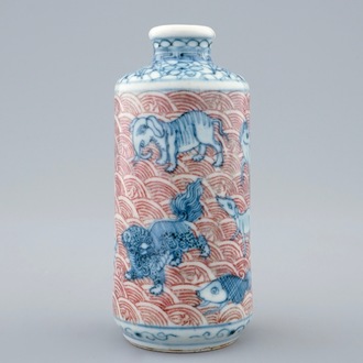 An unusual Chinese blue, white and underglaze red snuff bottle with animals, 18/19th C.