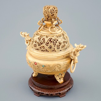 A Chinese inlaid and carved ivory tripod censer on wooden base, 19th C.