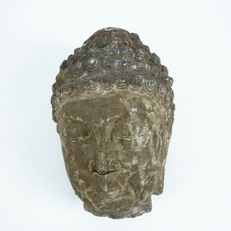 A large carved grey stone head of Buddha, China or Tibet, poss. 16/17th C.