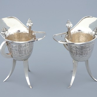 A pair of Chinese silver archaic "Jue" wine cups marked for Heng Li, Tientsin, 19th C.
