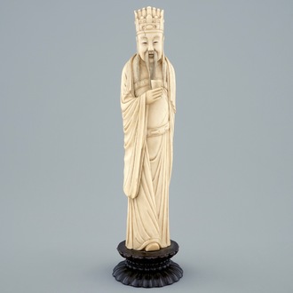 A Chinese carved ivory figure of a sage with a beaker on a lotus-shaped base, 19th C.
