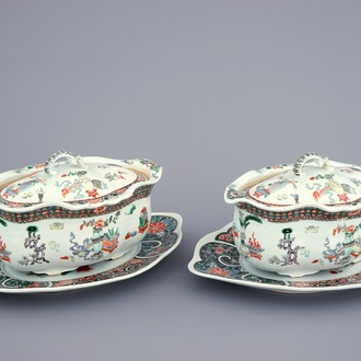 A pair of Chinese famille verte tureens and covers on stands, 19th C.