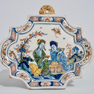 A polychrome Dutch Delft chinoiserie tea scene plaque, 18th C.