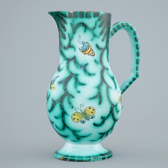 A Brussels faience water jug with butterflies and caterpillars, 18/19th C.