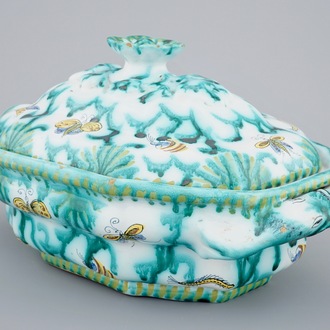 A Brussels faience tureen and cover with butterflies and caterpillars, 18th C.