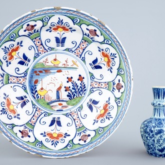 A Dutch Delft blue and white vase and a polychrome dish, 18th C.