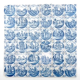 Un lot de 36 carreaux religieux en faïence de Delft bleu et blanc, 18ème