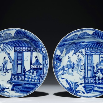A pair of Chinese blue and white chargers with a scene from "The Romance of the Western Chamber", Yongzheng