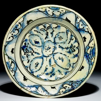 An Iznik pottery dish with blue and black design, Turkey, 17th C.