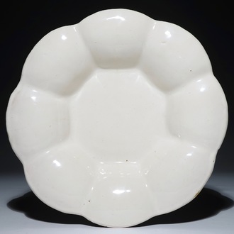 A white Dutch Delft gadrooned dish, 17th C.