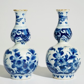 A pair of Dutch Delft blue and white double gourd vases, 1st quarter 18th C.