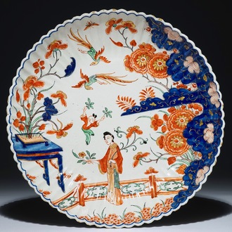 A Dutch Delft doré gadrooned chinoiserie dish with figures, early 18th C.