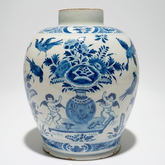 A Dutch Delft blue and white jar with putti design, 18th C.