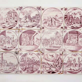 A set of 12 manganese Dutch Delft biblical tiles with carnation corners, 18th C.