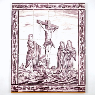 A manganese Dutch Delft 20 tile panel with Christ on the cross, late 18th C.