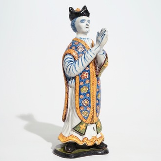 A large Dutch Delft polychrome figure of a standing priest, 18th C.