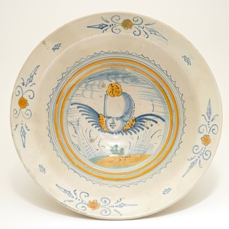 A Haarlem maiolica bowl with a cherub's head, early 17th C.