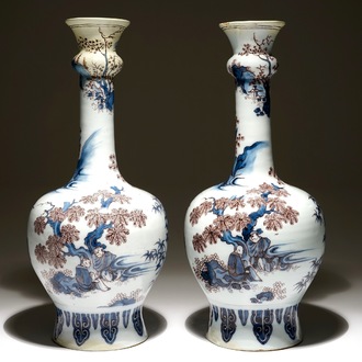 A pair of large Dutch Delft blue, white and manganese chinoiserie garlick neck vases, 17th C.