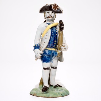 A polychrome pottery figure of a soldier, Brussels or France, 18th C.