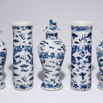 A five-piece Chinese blue and white garniture with dragons, 19th C.