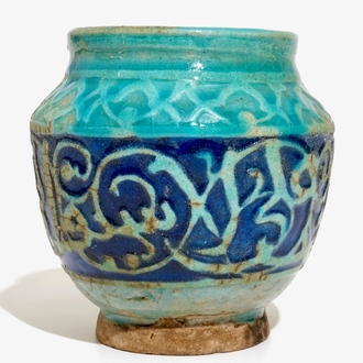 A turquoise and blue glazed calligraphy vase, Kashan, Iran, 12/13th C.