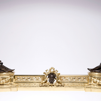 A three-piece patinated and gilt bronze adjustable fireplace fender, France, 19th C.