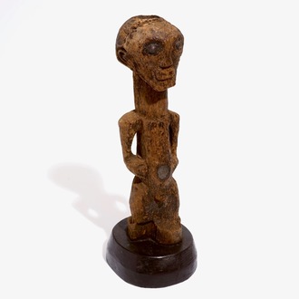 A Songye fetish on wooden base, D.R. Congo, 1st half 20th C.