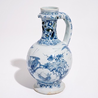 A rare Dutch Delft blue and white chinoiserie puzzle jug, late 17th C.