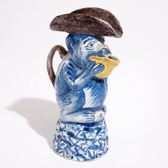 A polychrome Dutch Delft milk jug in the shape of a monkey, 19th C.
