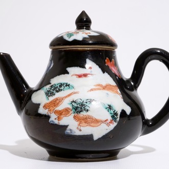 A Chinese black ground famille rose teapot and cover with geese, Yongzheng/Qianlong
