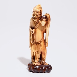 A Chinese carved ivory figure of a sage with a teapot, 18th C