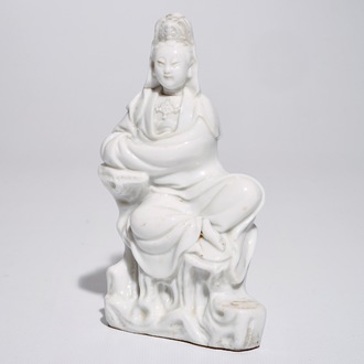 A Chinese Dehua blanc de Chine Guanyin seated on a rock, 18th C.