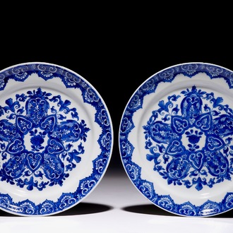 A pair of Chinese blue and white plates after Dutch Delft examples, Kangxi