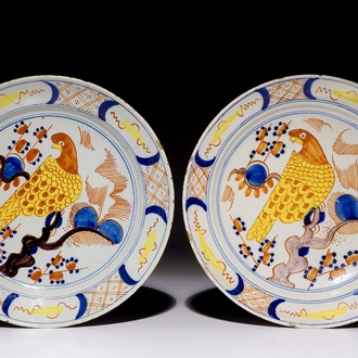 A pair of polychrome Dutch Delft plates with parrots, 18th C.