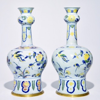 A pair of tall bronze-mounted polychrome Dutch Delft garlic-necked vases, late 17th C.