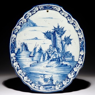 A Dutch Delft blue and white plaque with a pastoral scene, 18th C.