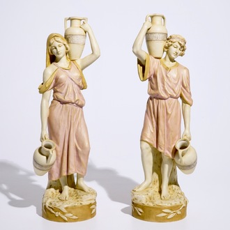 A pair of large Royal Dux Greek style figures carrying jugs, Bohemia, early 20th C.