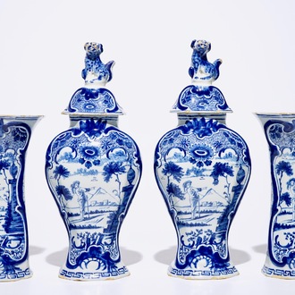 A fine Dutch Delft blue and white four-piece garniture with a farmer, 2nd half 18th C.