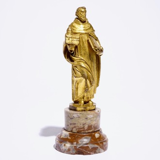 A gilt bronze model of a saint on a later marble base, 17th C.