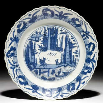 A Chinese blue and white fluted landscape dish, Ming