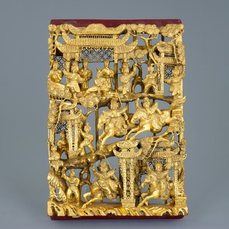 A Chinese carved gilt wood panel with a fighting scene, Ningbo, 19/20th C.