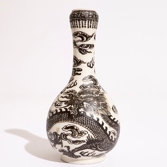 A Chinese black-enamelled biscuit porcelain "dragon" vase, Xuande mark, 18/19th C.