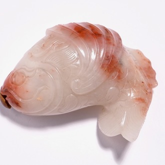 A Chinese carved red and white jade snuff bottle in the shape of a carp, 19th C.
